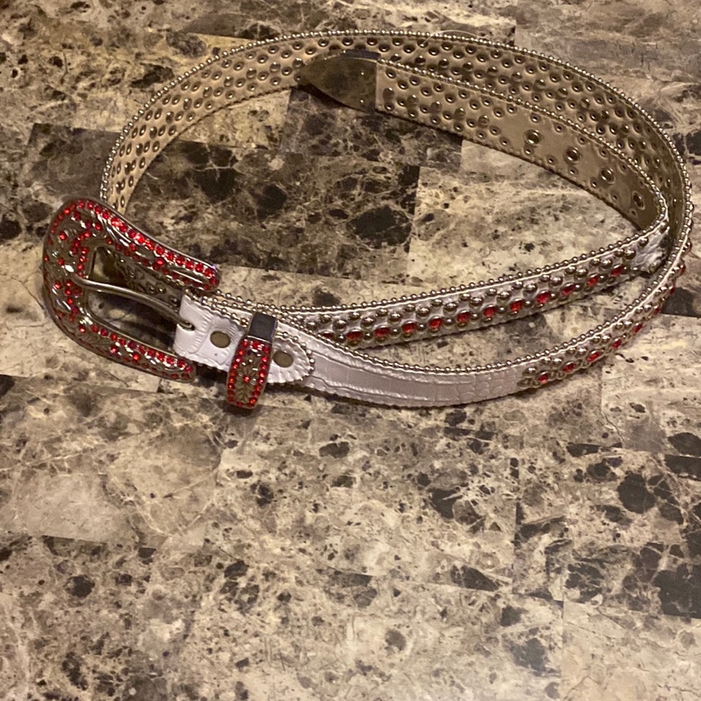 White and red bezel belt light wear and tear good shape.